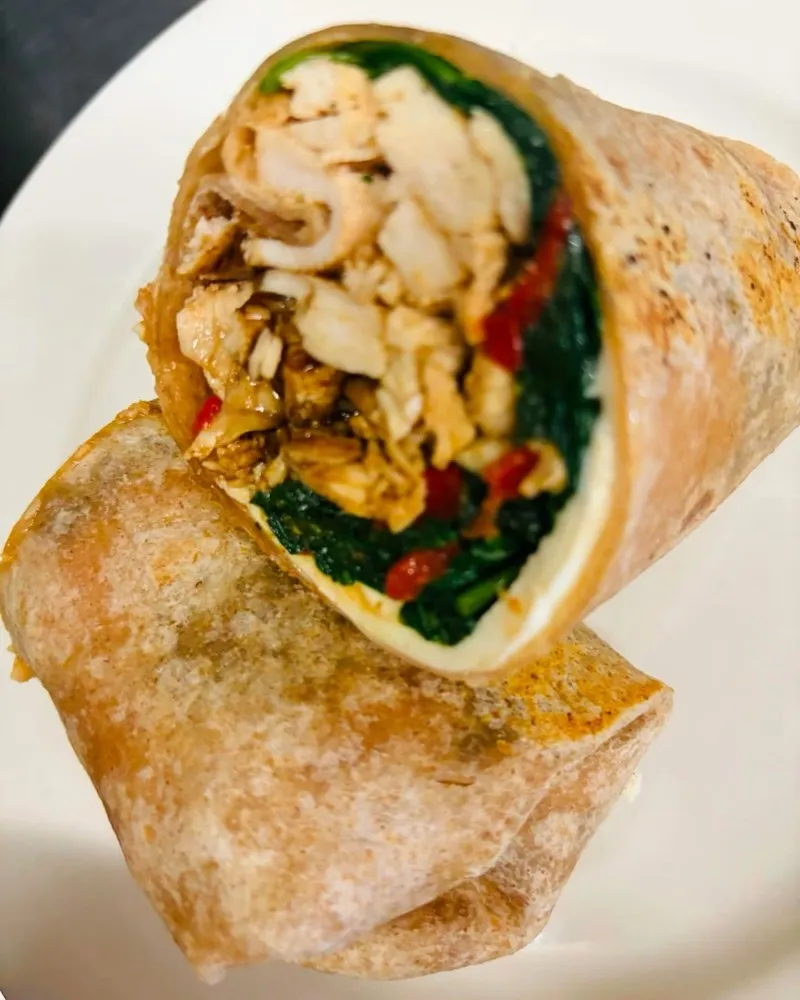 Chicken and vegetable wrap cut in half